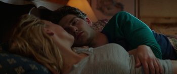 Movie still from “Cabin Fever” (2016), directed by Travis Zariwny – A man and a woman are sleeping in a bed; Close Up shot, Over the shoulder angle