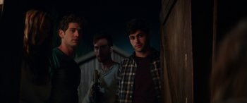 Movie still from “Cabin Fever” (2016), directed by Travis Zariwny – A group of young men standing next to each other; Medium shot, Over the shoulder angle