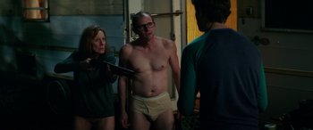 Movie still from “Cabin Fever” (2016), directed by Travis Zariwny – A man and a woman standing next to each other in their underwear; Medium shot, Over the shoulder angle