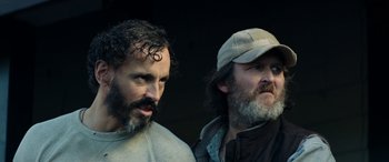 Movie still from “Cabin Fever” (2016), directed by Travis Zariwny – Two bearded men standing next to each other; Close Up shot, Low angle