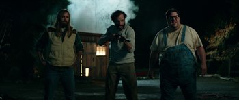 Movie still from “Cabin Fever” (2016), directed by Travis Zariwny – A group of people standing in the dark; Medium shot, Over the shoulder angle