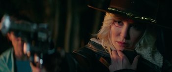 Movie still from “Cabin Fever” (2016), directed by Travis Zariwny – A woman in a cowboy hat and jacket; Close Up shot, Over the shoulder angle