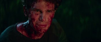 Movie still from “Cabin Fever” (2016), directed by Travis Zariwny – A man with blood all over his face and chest; Close Up shot, Over the shoulder angle