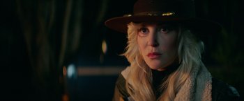 Movie still from “Cabin Fever” (2016), directed by Travis Zariwny – A person wearing a hat; Close Up shot, Over the shoulder angle