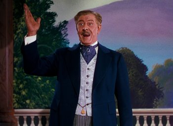 Movie still from “Calamity Jane” (1953), directed by David Butler – A man in a suit and tie waving; Medium shot, Low angle