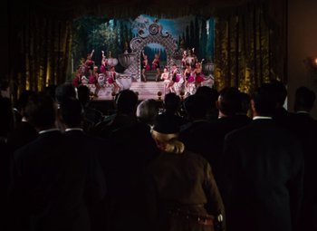 Movie still from “Calamity Jane” (1953), directed by David Butler – A crowd of people watching a performance on a stage; Wide shot, High angle