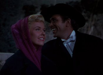 Movie still from “Calamity Jane” (1953), directed by David Butler – A man and a woman standing next to each other; Close Up shot, Low angle