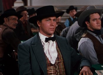 Movie still from “Calamity Jane” (1953), directed by David Butler – A man wearing a hat and a tie; Medium shot, Low angle