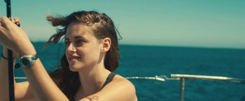 Movie still from “Camp X-Ray” (2014), directed by Peter Sattler – A beautiful young lady standing on top of a boat; Close Up shot, High angle