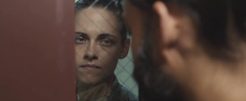 Movie still from “Camp X-Ray” (2014), directed by Peter Sattler – A person looking at a mirror; Close Up shot, Over the shoulder angle