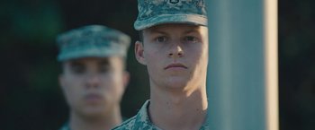 Movie still from “Camp X-Ray” (2014), directed by Peter Sattler – A person wearing a military uniform; Close Up shot, Low angle