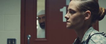 Movie still from “Camp X-Ray” (2014), directed by Peter Sattler – A man and a woman in front of a mirror; Close Up shot, Over the shoulder angle