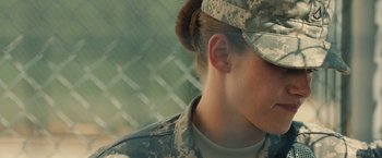 Movie still from “Camp X-Ray” (2014), directed by Peter Sattler – A woman in a military uniform; Close Up shot, Over the shoulder angle