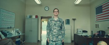 Movie still from “Camp X-Ray” (2014), directed by Peter Sattler – A man in a military uniform standing in a room; Wide shot, Low angle