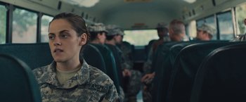 Movie still from “Camp X-Ray” (2014), directed by Peter Sattler – A group of people in uniform on a bus; Medium shot, Over the shoulder angle