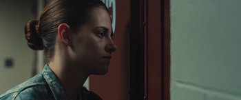Movie still from “Camp X-Ray” (2014), directed by Peter Sattler – A woman is looking to her left side; Close Up shot, Low angle