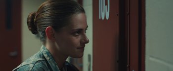 Movie still from “Camp X-Ray” (2014), directed by Peter Sattler – A person looking to the side; Close Up shot, Over the shoulder angle