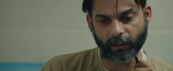 Movie still from “Camp X-Ray” (2014), directed by Peter Sattler – A person with a beard; Close Up shot, High angle