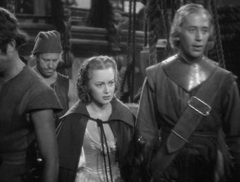 Movie still from “Captain Blood” (1935), directed by Michael Curtiz – A group of men standing next to each other; Medium shot, High angle