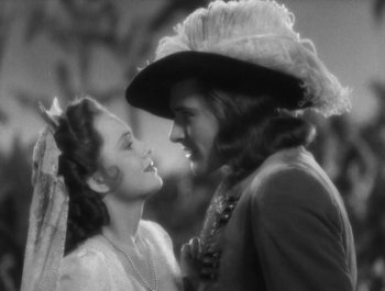 Movie still from “Captain Blood” (1935), directed by Michael Curtiz – A black and white photo of a man and a woman; Close Up shot, Over the shoulder angle