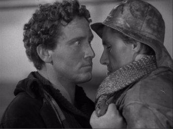 Movie still from “Captains Courageous” (1937), directed by Victor Fleming – A man and a woman face to face in a black and white photo; Close Up shot, High angle