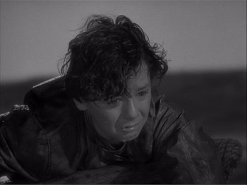 Movie still from “Captains Courageous” (1937), directed by Victor Fleming – A black - and - white photo of a woman with curly hair; Close Up shot, High angle