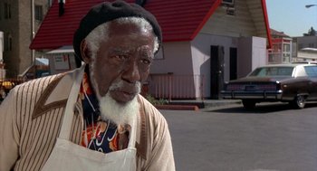 Movie still from “Car Wash” (1976), directed by Michael Schultz – An older man with a beard and a hat; Close Up shot, Low angle