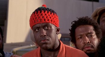 Movie still from “Car Wash” (1976), directed by Michael Schultz – A person wearing a crocheted hat; Close Up shot, Low angle