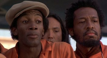 Movie still from “Car Wash” (1976), directed by Michael Schultz – A group of men standing next to each other; Close Up shot, Low angle