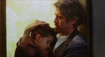 Movie still from “Caravaggio” (1986), directed by Derek Jarman – A man and a boy are looking at each other; Close Up shot, Over the shoulder angle