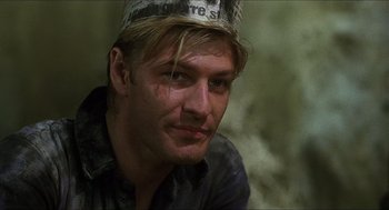 Movie still from “Caravaggio” (1986), directed by Derek Jarman – A person wearing a hat; Close Up shot, Low angle
