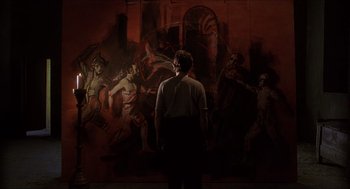 Movie still from “Caravaggio” (1986), directed by Derek Jarman – A man standing in front of a wall with a painting on it; Wide shot, Over the shoulder angle
