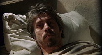 Movie still from “Caravaggio” (1986), directed by Derek Jarman – A person laying in a bed; Close Up shot, High angle