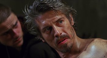 Movie still from “Caravaggio” (1986), directed by Derek Jarman – A person with long hair; Close Up shot, Over the shoulder angle