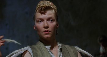 Movie still from “Caravaggio” (1986), directed by Derek Jarman – A person wearing a hat; Close Up shot, Low angle