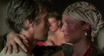 Movie still from “Caravaggio” (1986), directed by Derek Jarman – A man and a woman face to face in front of a crowd; Close Up shot, Over the shoulder angle