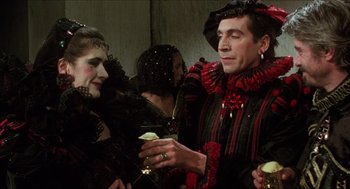 Movie still from “Caravaggio” (1986), directed by Derek Jarman – A man and a woman dressed in costumes; Medium shot, Over the shoulder angle