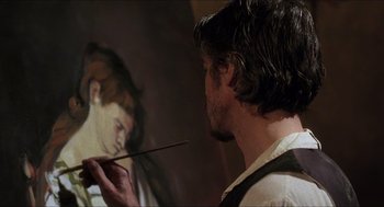 Movie still from “Caravaggio” (1986), directed by Derek Jarman – A man painting a picture of a woman with a paintbrush in front of him; Close Up shot, Over the shoulder angle