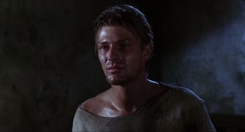 Movie still from “Caravaggio” (1986), directed by Derek Jarman – A person wearing a shirt; Close Up shot, Over the shoulder angle