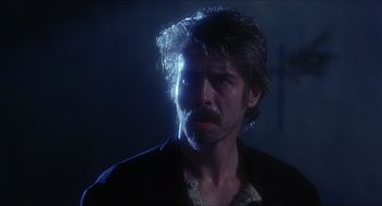 Movie still from “Caravaggio” (1986), directed by Derek Jarman – A person wearing a jacket; Close Up shot, Over the shoulder angle