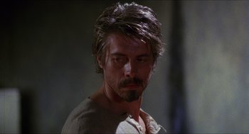 Movie still from “Caravaggio” (1986), directed by Derek Jarman – A person with a beard; Close Up shot, Over the shoulder angle