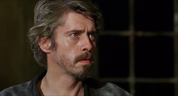Movie still from “Caravaggio” (1986), directed by Derek Jarman – A person with a beard; Close Up shot, Over the shoulder angle