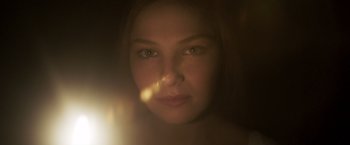 Movie still from “Carmilla” (2019), directed by Emily Harris – A woman's face in a dimly - lit room; Close Up shot, Low angle