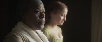 Movie still from “Carmilla” (2019), directed by Emily Harris – Two women are standing next to each other; Close Up shot, Over the shoulder angle