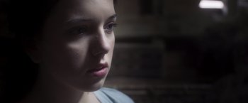 Movie still from “Carmilla” (2019), directed by Emily Harris – A person looking at the camera; Close Up shot, Over the shoulder angle