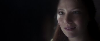 Movie still from “Carmilla” (2019), directed by Emily Harris – A young woman's face in the dark; Close Up shot, Over the shoulder angle