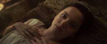 Movie still from “Carmilla” (2019), directed by Emily Harris – A beautiful young lady laying on top of a bed; Close Up shot, High angle