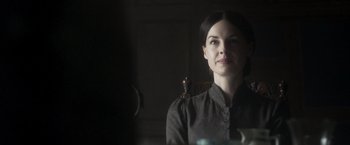 Movie still from “Carmilla” (2019), directed by Emily Harris – A woman is standing in front of a mirror; Close Up shot, Over the shoulder angle