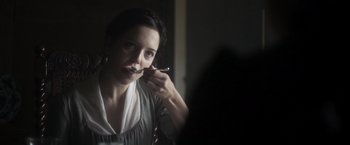Movie still from “Carmilla” (2019), directed by Emily Harris – A woman brushing her teeth in the mirror; Close Up shot, Over the shoulder angle