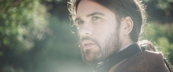 Movie still from “Carmilla” (2019), directed by Emily Harris – A person with a beard; Close Up shot, Low angle